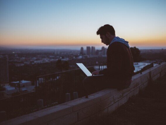 Man sitting on build edge